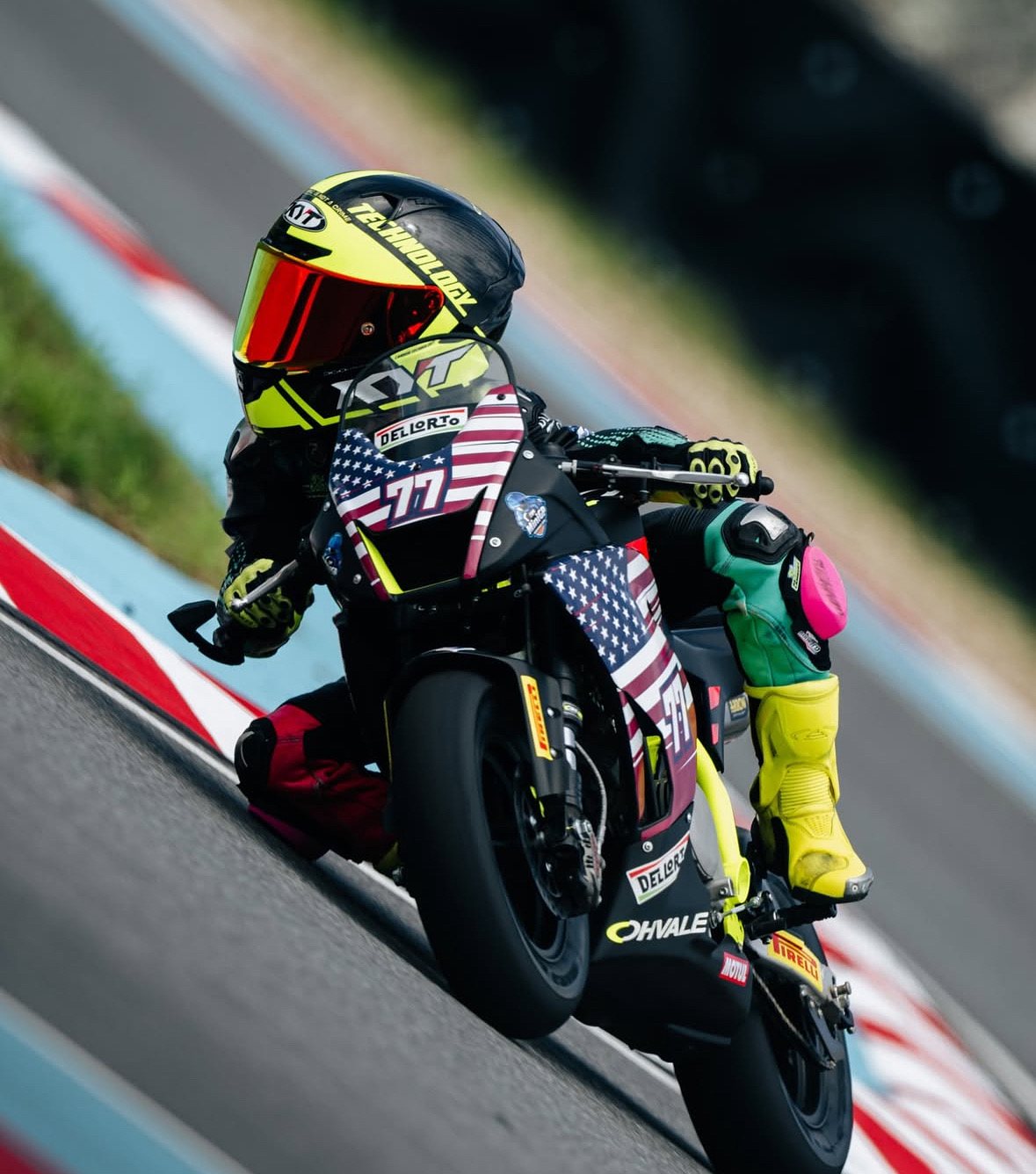 Lambert Su #77 leaning into a corner on his MiniGP bike in Korea